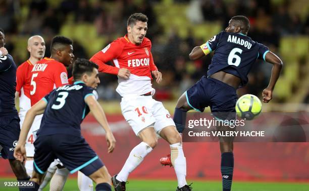 Monaco's Montenegrin forward Stevan Jovetic vies with Lille's French midefielder Ibrahim Amadou during the French L1 football match between Monaco...