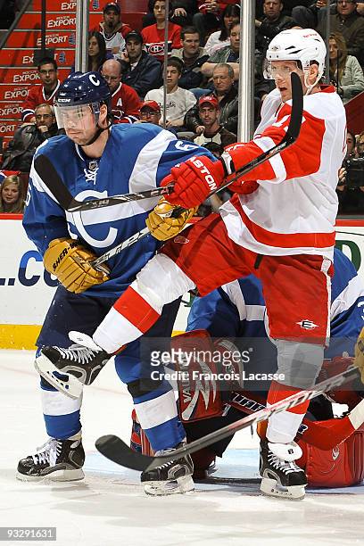 Jaroslav Spacek of the Montreal Canadiens battles with Daniel Cleary of the Detroit Red Wings during the NHL game on November 21, 2009 at the Bell...
