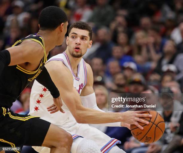 Zach LaVine of the Chicago Bulls moves against Derrick Williams of the Los Angeles Lakers at the United Center on January 26, 2018 in Chicago,...