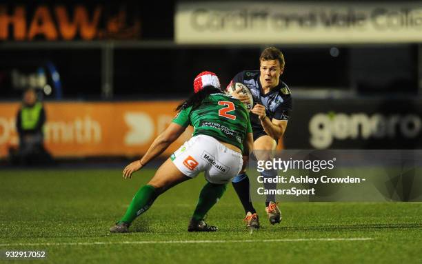 Cardiff Blues' Jarrod Evans is tackled by Bentton Rugbys Epalahame Faiva during the Guinness PRO12 Round 17 match between Cardiff Blues and Benetton...
