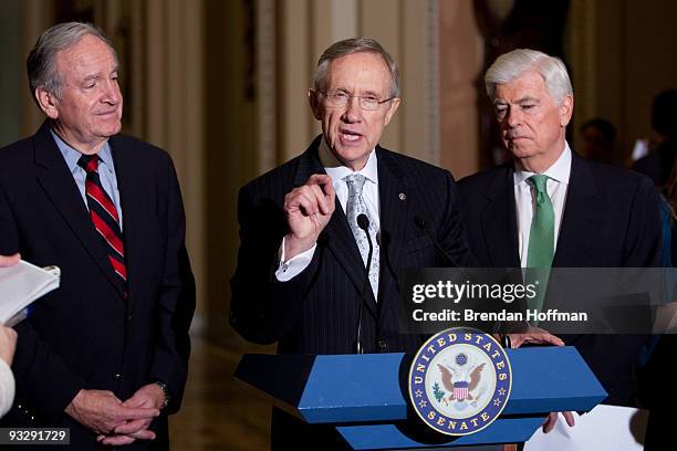 Senate Majority Leader Harry Reid speaks at a news conference as Sen. Chris Dodd and Sen. Tom Harkin look on following the Senate's cloture vote on...