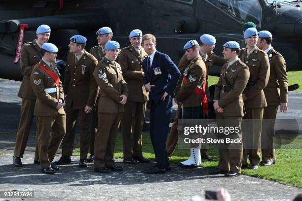 Prince Harry presents 12 pilots from course 17/02 of the Army Air Corps with their Wings during a ceremony at the Museum of Army Flying on March 16,...