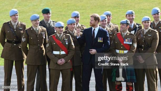 Prince Harry presents 12 pilots from course 17/02 of the Army Air Corps with their Wings during a ceremony at the Museum of Army Flying on March 16,...