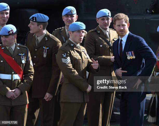 Prince Harry presents 12 pilots from course 17/02 of the Army Air Corps with their Wings during a ceremony at the Museum of Army Flying on March 16,...