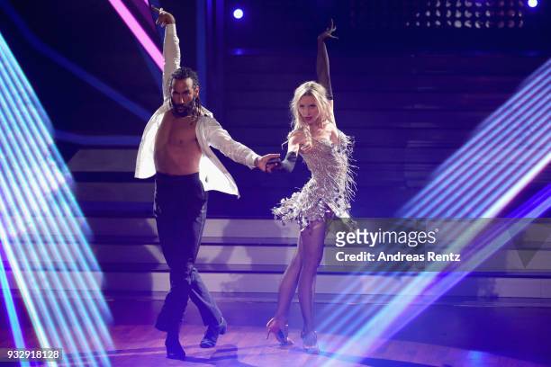 Julia Dietze and Massimo Sinato perform on stage during the 1st show of the 11th season of the television competition 'Let's Dance' on March 16, 2018...