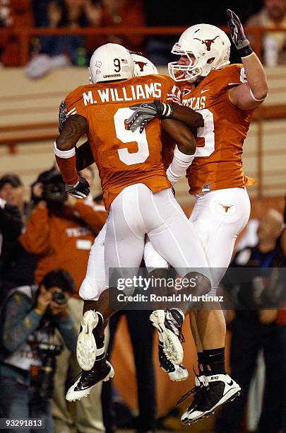 Wide receiver James Kirkendoll of the Texas Longhorns celebrates his touchdown with Malcolm Williams and Greg Smith at Darrell K Royal-Texas Memorial...