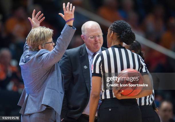 Tennessee Lady Volunteers head coach Holly Warlick and Liberty Lady Flames head coach Carey Green speak to an official about a call from during a...