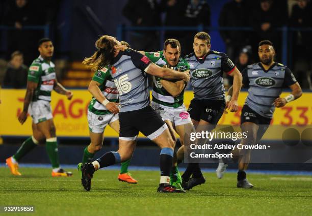 Bentton Rugbys Giorgio Bronzini is tackled by Cardiff Blues' Kristian Dacey during the Guinness PRO12 Round 17 match between Cardiff Blues and...