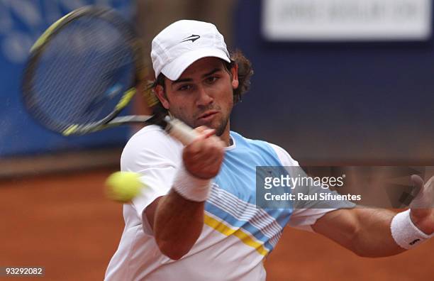 Eduardo Schwank of Argentina returns a shot against Jorge Aguilar of Chile during the Lima Challenger Movistar Open on November 21, 2009 in Lima,...