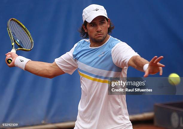 Eduardo Schwank of Argentina returns a shot against Jorge Aguilar of Chile during the Lima Challenger Movistar Open on November 21, 2009 in Lima,...