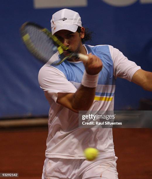 Eduardo Schwank of Argentina returns a shot against Jorge Aguilar of Chile during the Lima Challenger Movistar Open on November 21, 2009 in Lima,...