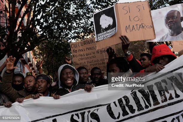 Demonstrators protest after the death of a Senegalese street vendor at the Lavapies neighborhood in Madrid on 16th March, 2018. Yesterday, clashes...