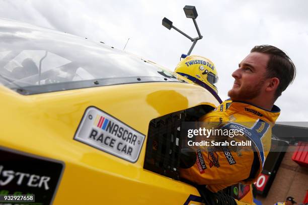 Ty Dillon, driver of the Twisted Tea Chevrolet, climbs into his car during qualifying for the Monster Energy NASCAR Cup Series Auto Club 400 at Auto...