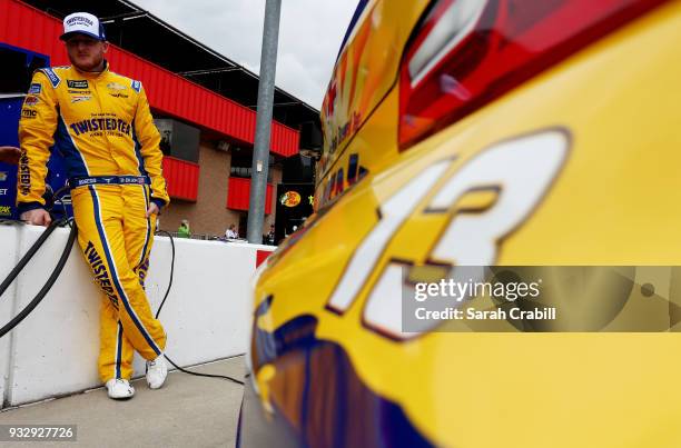 Ty Dillon, driver of the Twisted Tea Chevrolet, stands on the grid during qualifying for the Monster Energy NASCAR Cup Series Auto Club 400 at Auto...