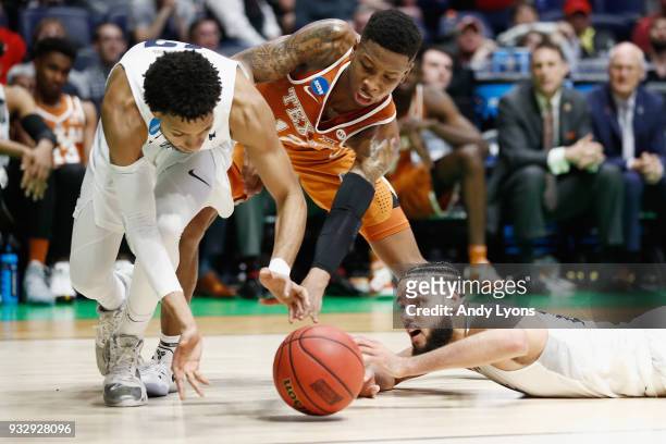 Kerwin Roach II of the Texas Longhorns fights for a loose ball with Hallice Cooke and Caleb Martin of the Nevada Wolf Pack during the game in the...