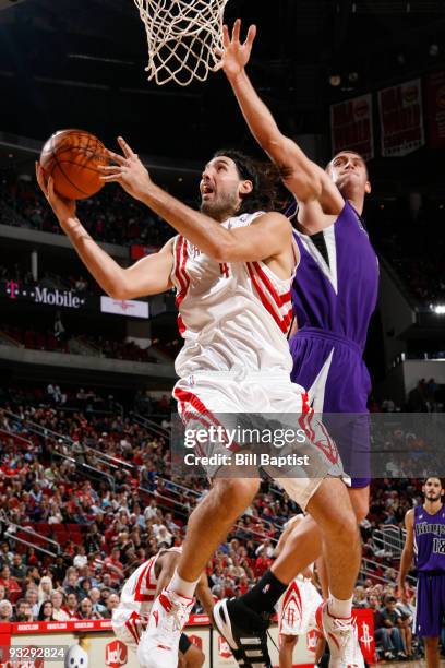 Luis Scola of the Houston Rockets shoots the ball over Beno Udrih of the Sacramento Kings on November 21, 2009 at the Toyota Center in Houston,...