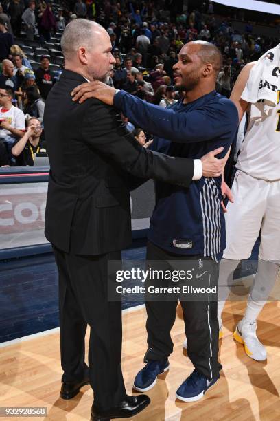 Jameer Nelson of the Detroit Pistons greets Head Coach Michael Malone of the Denver Nuggets after the game on March 15, 2018 at the Pepsi Center in...