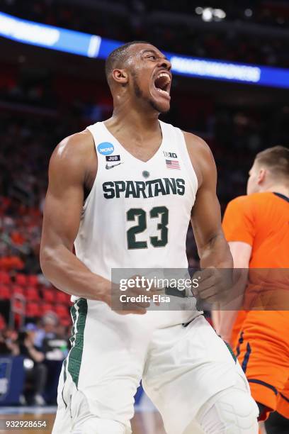 Xavier Tillman of the Michigan State Spartans celebrates after dunking the ball during the first half against the Bucknell Bison in the first round...