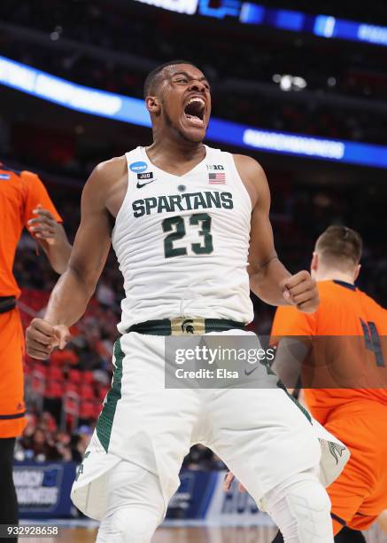 Xavier Tillman of the Michigan State Spartans celebrates after dunking the ball during the first half against the Bucknell Bison in the first round...