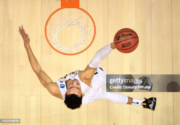 Landry Shamet of the Wichita State Shockers shoots against the Marshall Thundering Herd during the first round of the 2018 NCAA Men's Basketball...