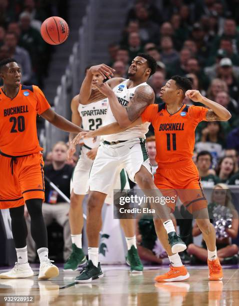 Xavier Tillman of the Michigan State Spartans and Avi Toomer of the Bucknell Bison battle for a rebound during the first half in the first round of...