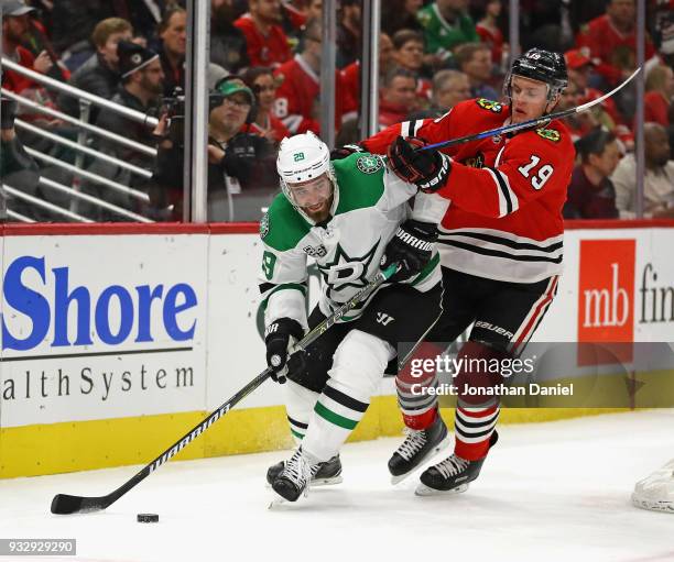 Greg Pateryn of the Dallas Stars is pressured by Jonathan Toews of the Chicago Blackhawks at the United Center on February 8 2018 in Chicago,...