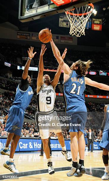 Tony Parker of the San Antonio Spurs is blocked by Fabricio Oberto of the Washington Wizards on November 21, 2009 at the AT&T Center in San Antonio,...