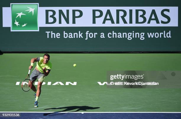 Philipp Kohlschreiber of Germany serves against Juan Martin Del Porto of Argentina during Day 12 of BNP Paribas Open on March 16, 2018 in Indian...