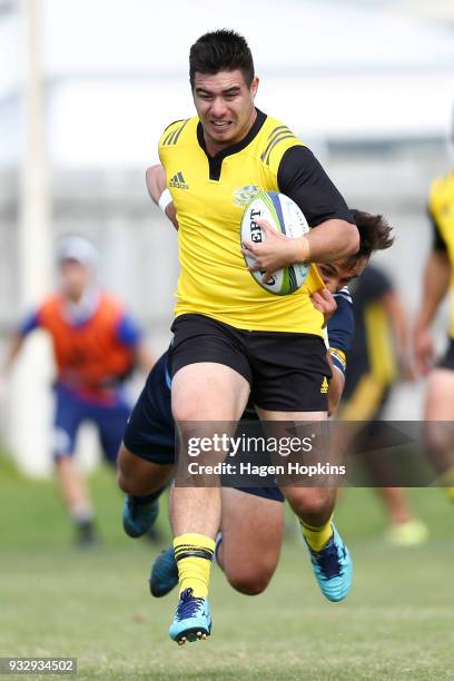 Jackson Garden-Bachop of the Hurricanes is tackled by Harry Plummer of the Blues A Team during the development squad trial match between the...