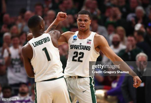 Miles Bridges of the Michigan State Spartans celebrates with Joshua Langford during the second half against the Bucknell Bison in the first round of...