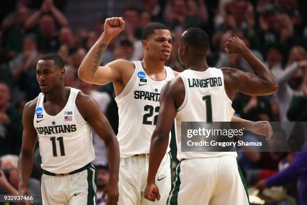 Miles Bridges of the Michigan State Spartans celebrates with Joshua Langford during the second half against the Bucknell Bison in the first round of...