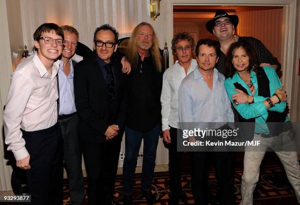 Sam Fox, Curtis Schenker, Elvis Costello, Gregg Allman, Roger Daltrey, Michael J. Fox, John Popper and Steven Tyler pose backstage during The Michael...