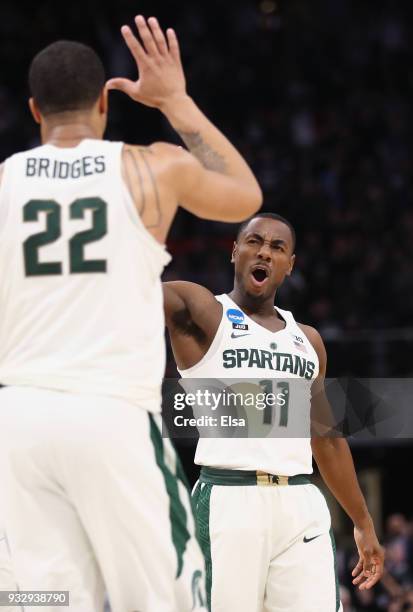 Lourawls Nairn Jr. #11 of the Michigan State Spartans celebrates with Miles Bridges during the second half against the Bucknell Bison in the first...