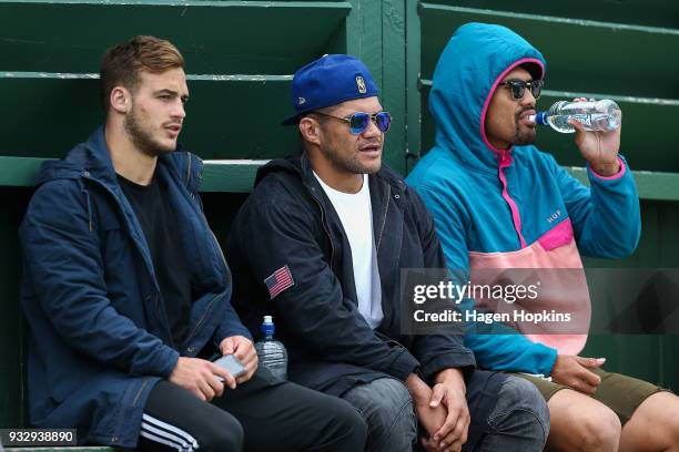 To R, Wes Goosen, Chris Eves and Ardie Savea of the Hurricanes look on during the development squad trial match between the Hurricanes and the Blues...