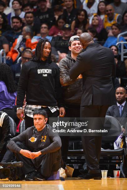 Magic Johnson greets Todd Gurley during the Los Angeles Lakers v Cleveland Cavaliers game on March 11, 2018 at STAPLES Center in Los Angeles,...
