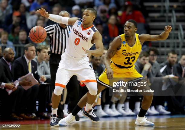 Devon Hall of the Virginia Cavaliers grabs a loose ball against Arkel Lamar of the UMBC Retrievers during the first round of the 2018 NCAA Men's...