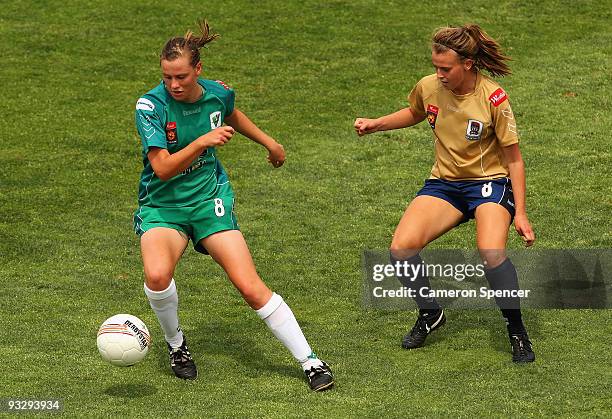 Emily Van Egmond of Canberra controls the ball ahead of Bronte Bates of the Jets during the round eight W-League match between the Newcastle Jets and...