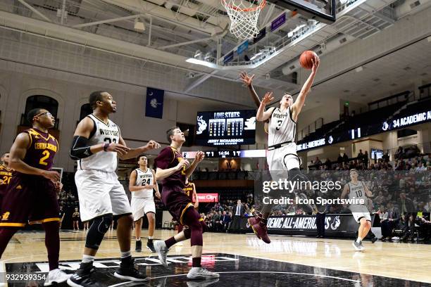 Fletcher Magee guard Wofford College Terriers makes a lay-up for two of his game-high 37 points against the Central Michigan University Chippewas,...