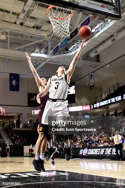 Fletcher Magee guard Wofford College Terriers makes a lay-up for two of his game-high 37 points against the Central Michigan University Chippewas,...