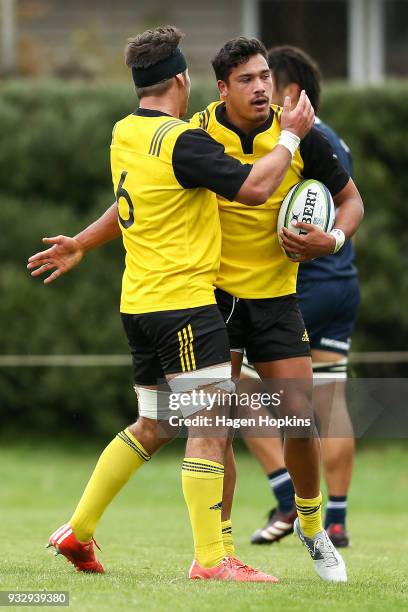 Billy Proctor of the Hurricanes celebrates with Sam Henwood after scoring a try during the development squad trial match between the Hurricanes and...