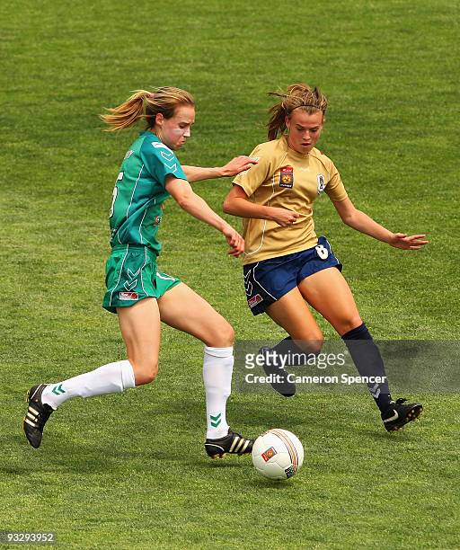 Ellyse Perry of Canberra contests the ball with Bronte Bates of the Jets during the round eight W-League match between the Newcastle Jets and...