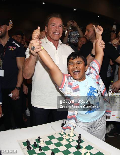 Arnold Schwarzenegger greets Sharath Thandi after a game of chess during the Arnold Sports Festival Australia at The Melbourne Convention and...