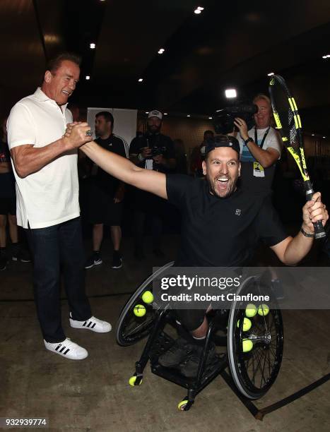 Arnold Schwarzenegger greets Australian Open wheelchair tennis champion Dylan Alcott during the Arnold Sports Festival Australia at The Melbourne...