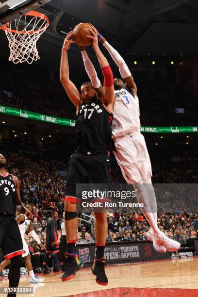Jonas Valanciunas of the Toronto Raptors and Nerlens Noel of the Dallas Mavericks compete for the ball on March 16, 2018 at the Air Canada Centre in...