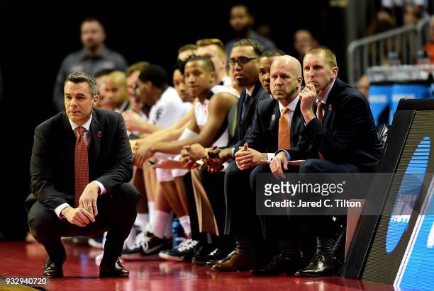 Head coach Tony Bennett of the Virginia Cavaliers and his coaching staff watch their team against the UMBC Retrievers during the first round of the...