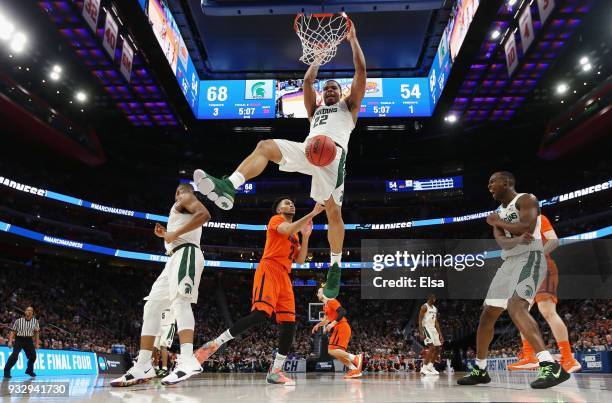 Miles Bridges of the Michigan State Spartans dunks the ball during the second half against the Bucknell Bison in the first round of the 2018 NCAA...