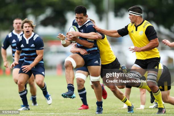 Sione Havili of the Blues A Team is tackled during the development squad trial match between the Hurricanes and the Blues at Evans Bay Park on March...