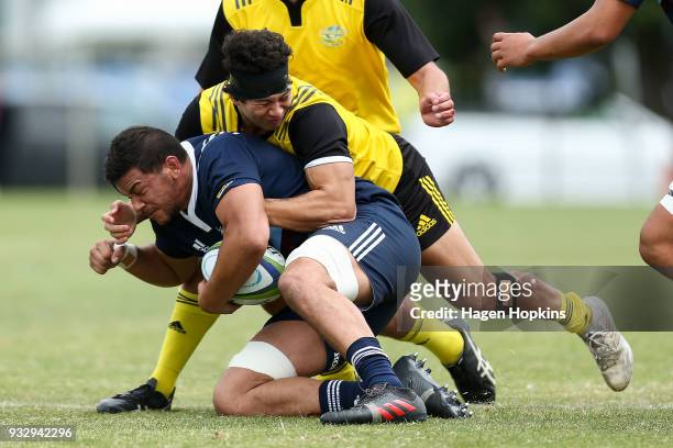 Ben Neenee of the Blues A Team is tackled during the development squad trial match between the Hurricanes and the Blues at Evans Bay Park on March...
