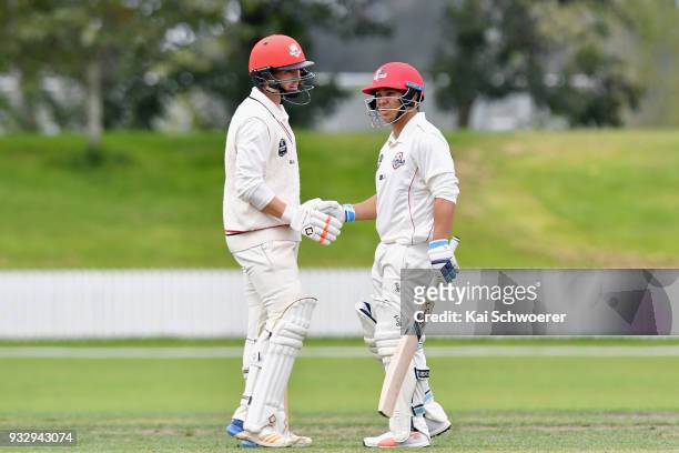 Ken McClure of Canterbury is congratulated by Cole McConchie of Canterbury after scoring his half century during the Plunket Shield match between...