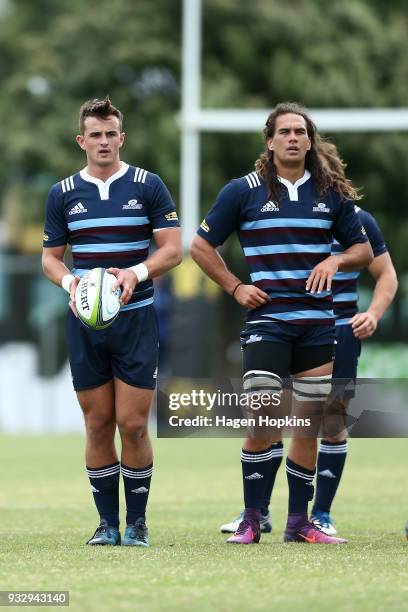 Harry Plummer of the Blues A Team lines up a kick while Kara Pryor looks on during the development squad trial match between the Hurricanes and the...